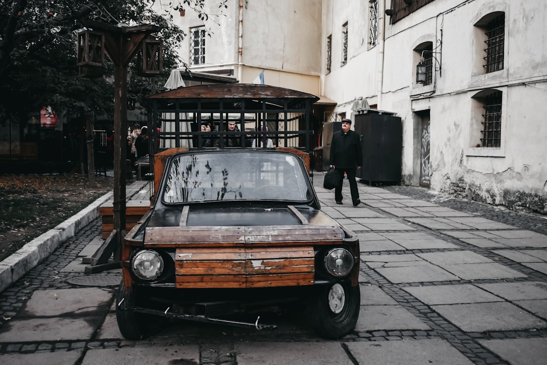 brown vehicle on pavement