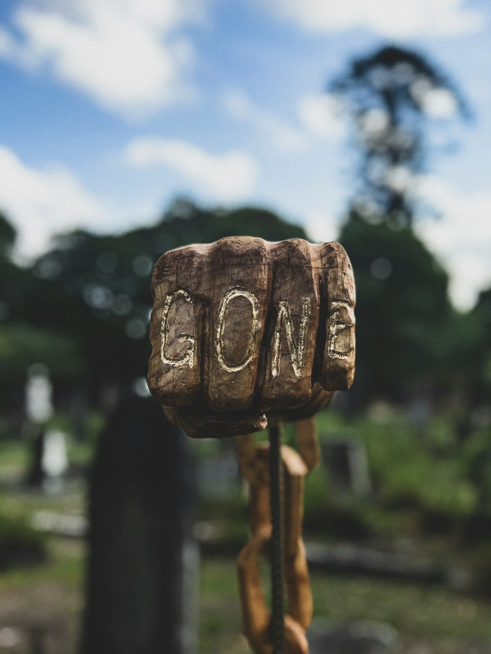 selective focus photo of human fist with gone engrave decor