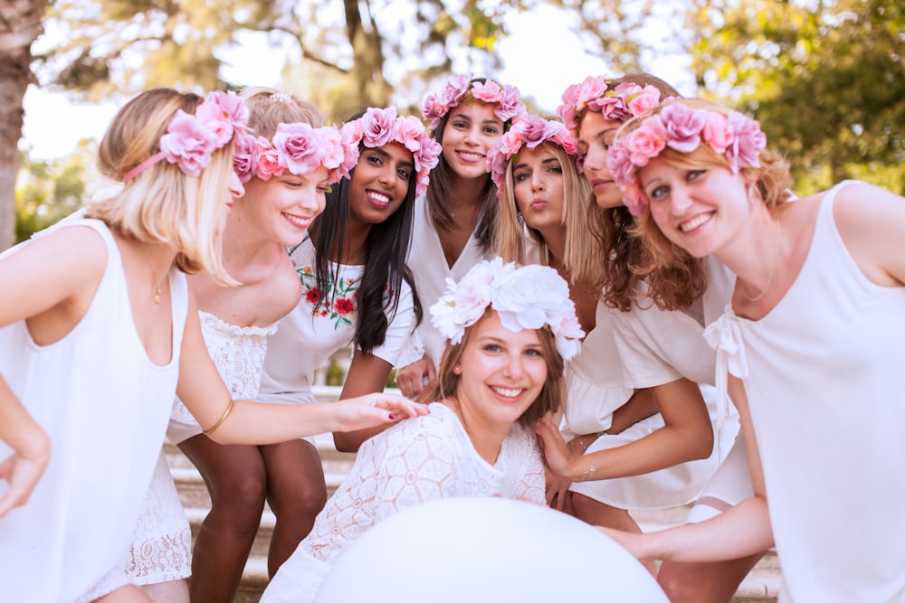photo shoot of bride and her bridesmaid wearing floral tiaras
