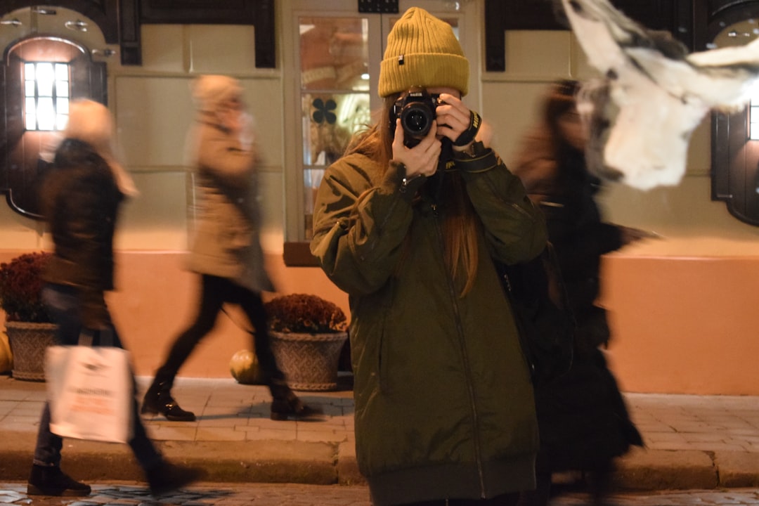 woman holding DSLR camera