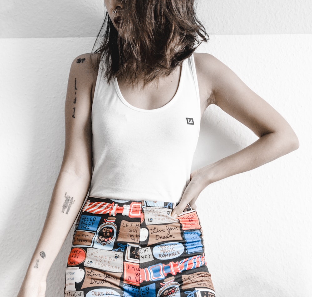 woman standing in front of white wall