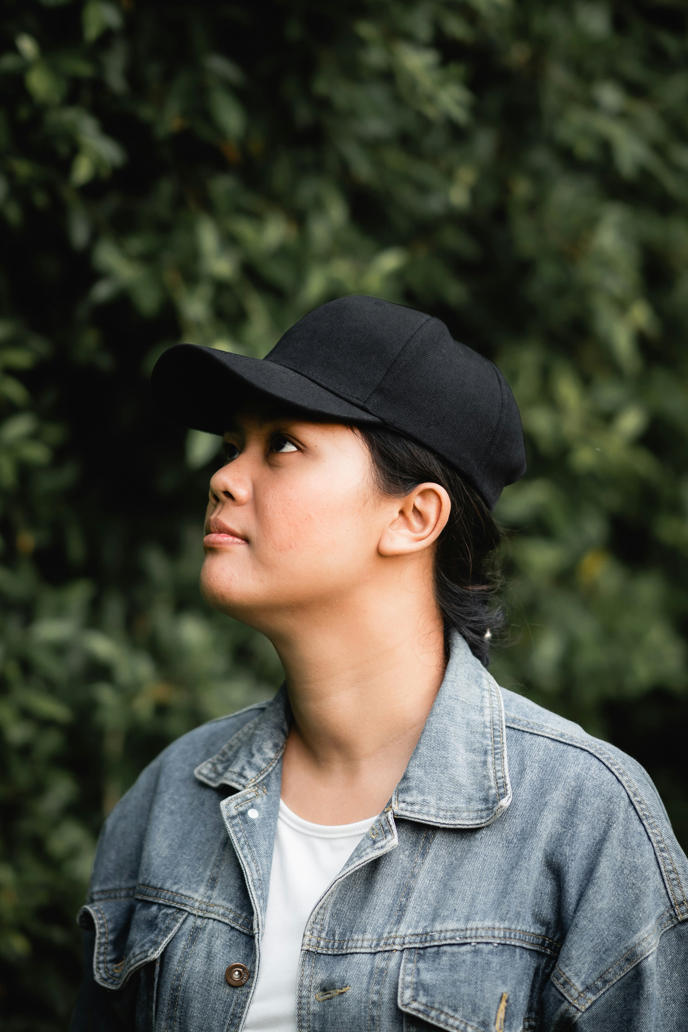woman standing near green plant