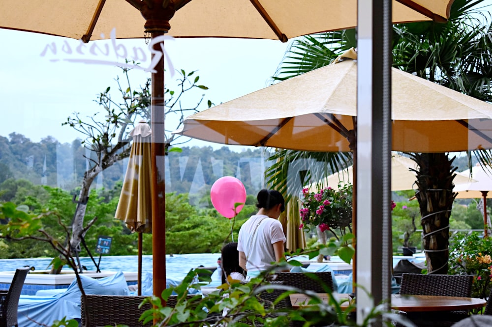 woman under brown parasol