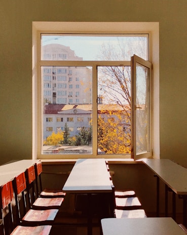 brown wooden chairs and white tables