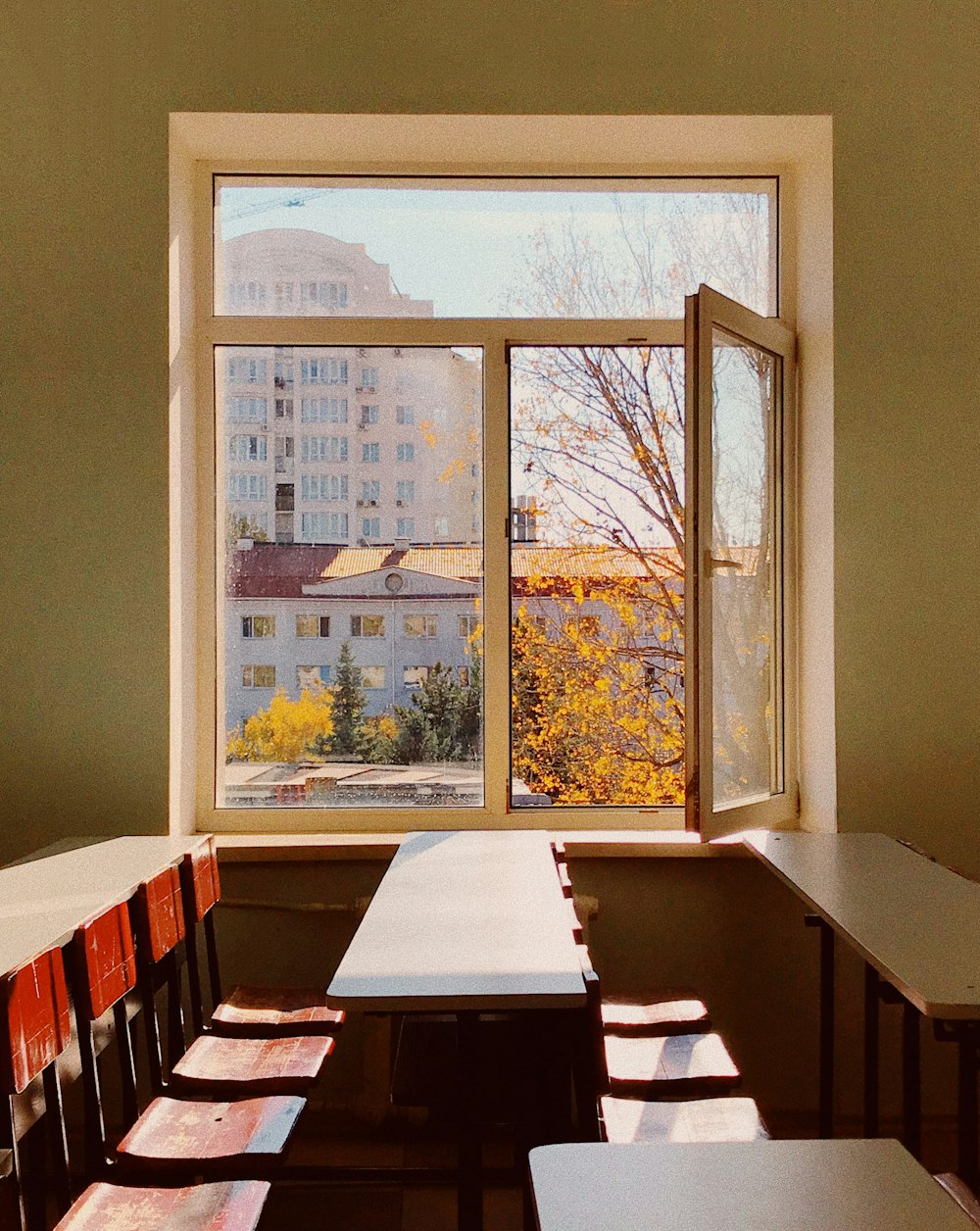 brown wooden chairs and white tables