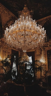 white and gold-colored chandelier