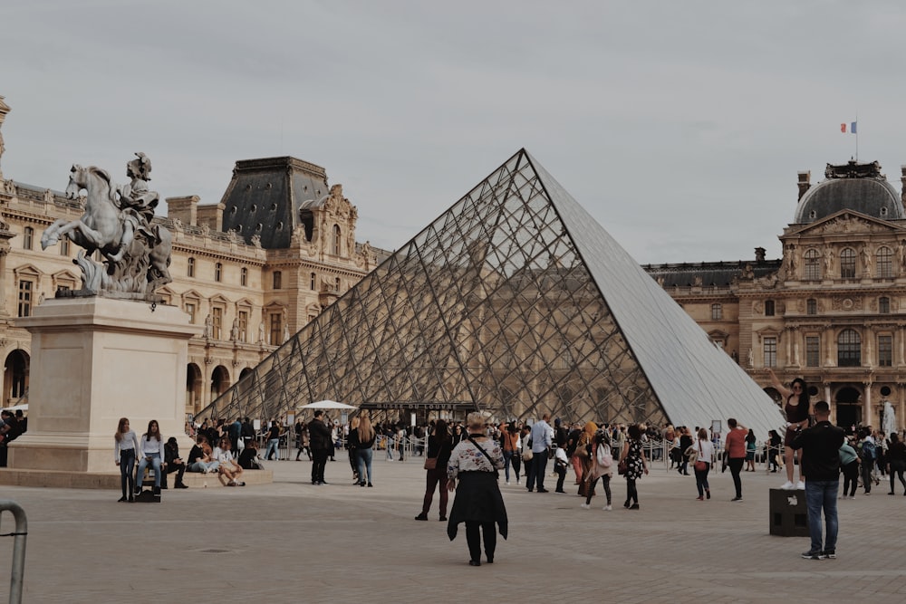 people walking near Louvre Museum during daytime