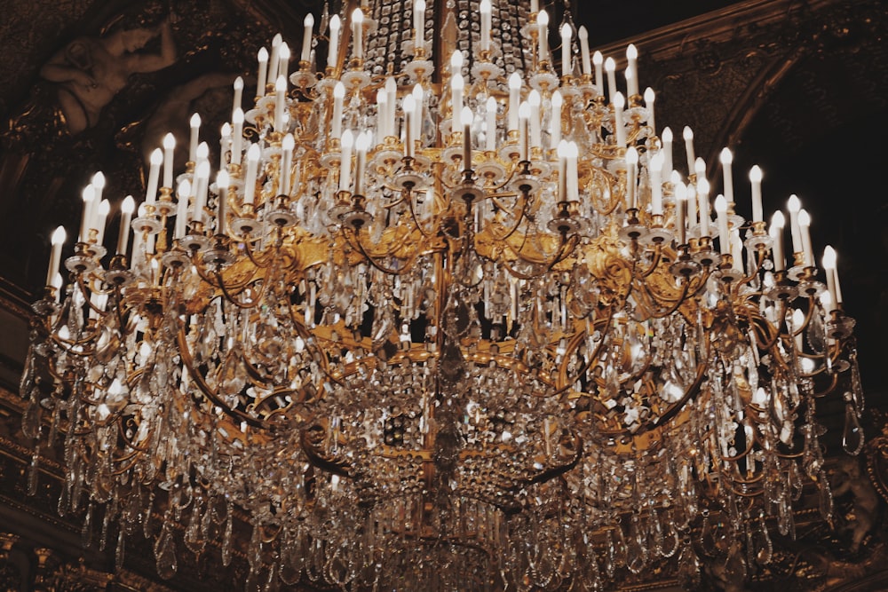 gold-colored uplight chandelier