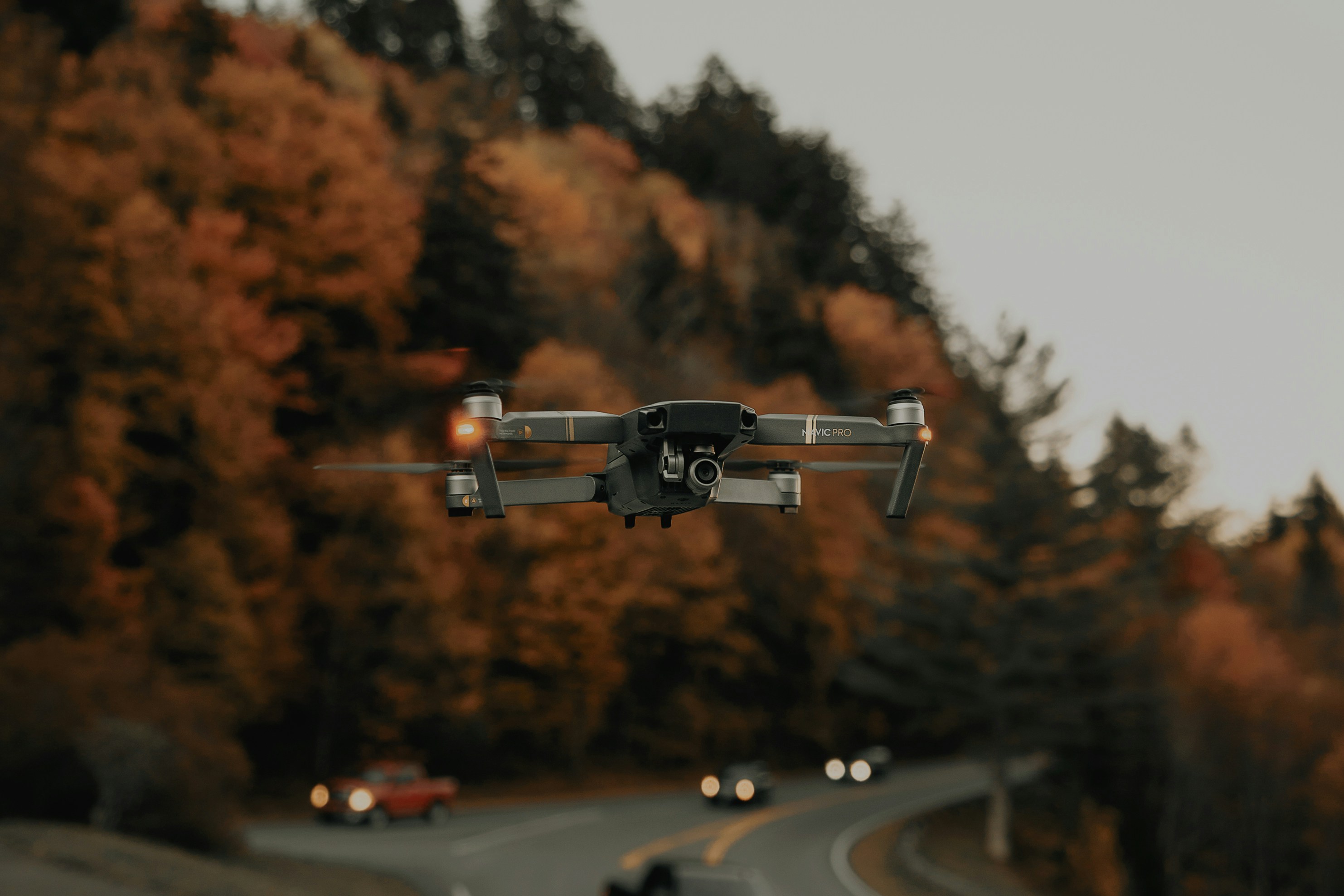 gray and black drone midair, Hovering the Mavic Pro around some autumn trees (1/2) (IG: @clay.banks)