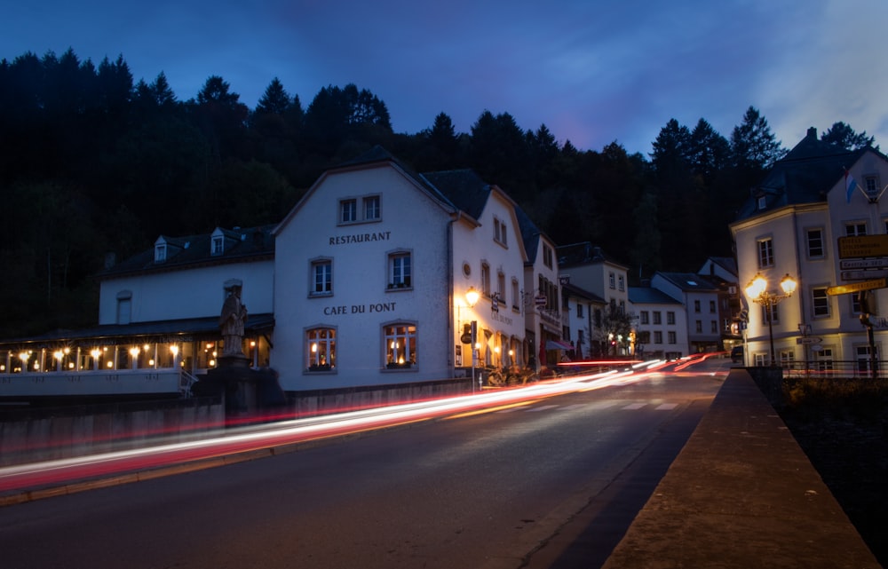 time-lapse photography of white and brown houses during night time