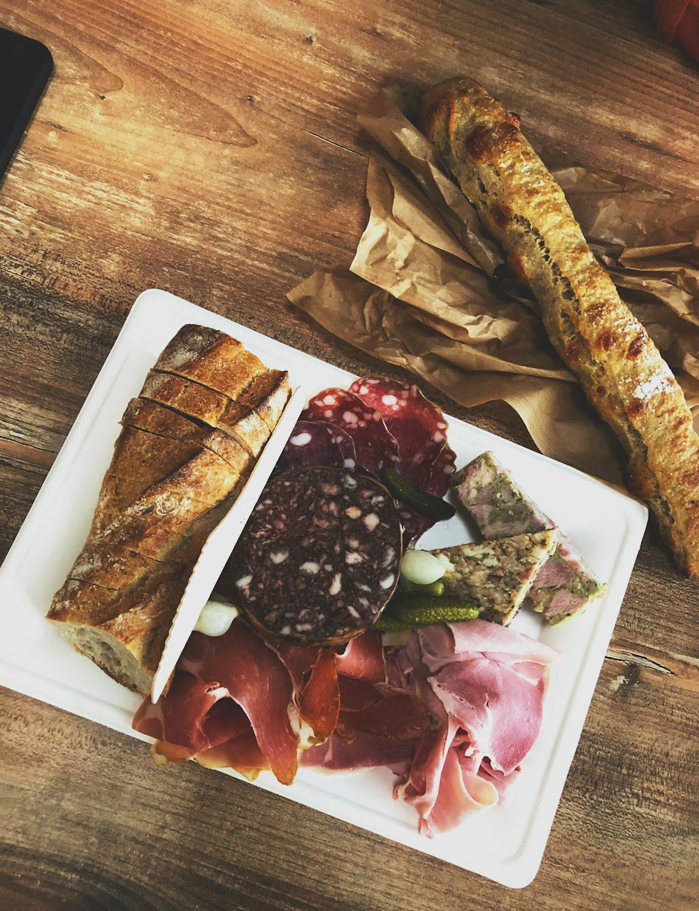 bread and fruits on plate