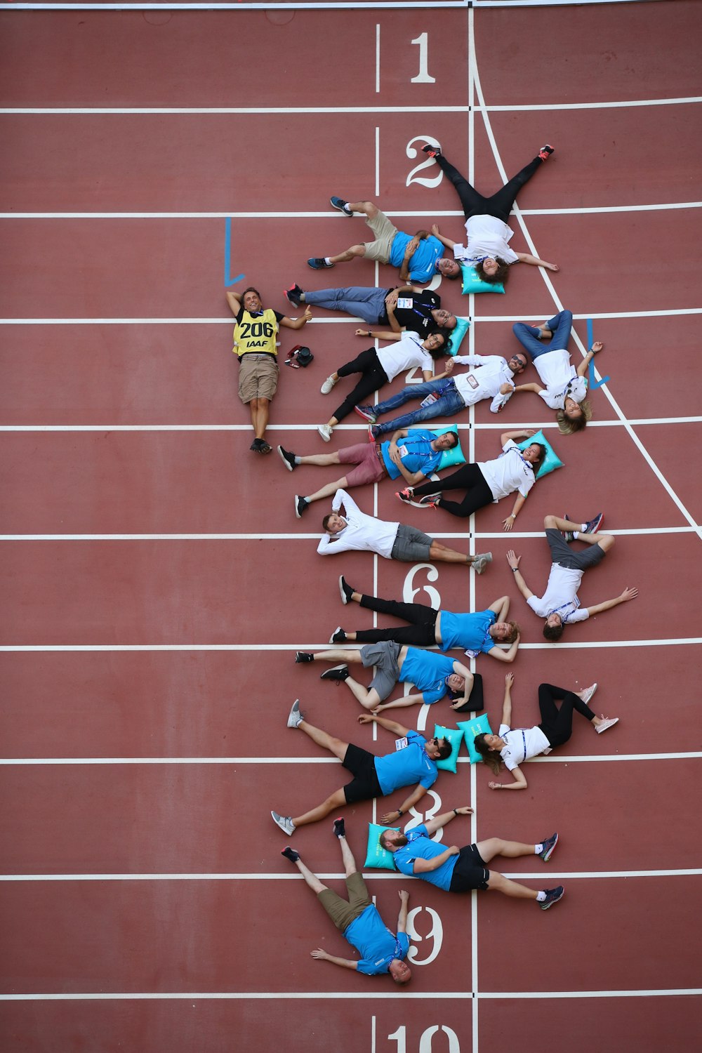 people lying on maroon surface