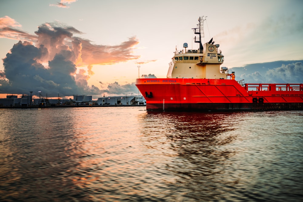 red and white cruise ship on the body of water photograph