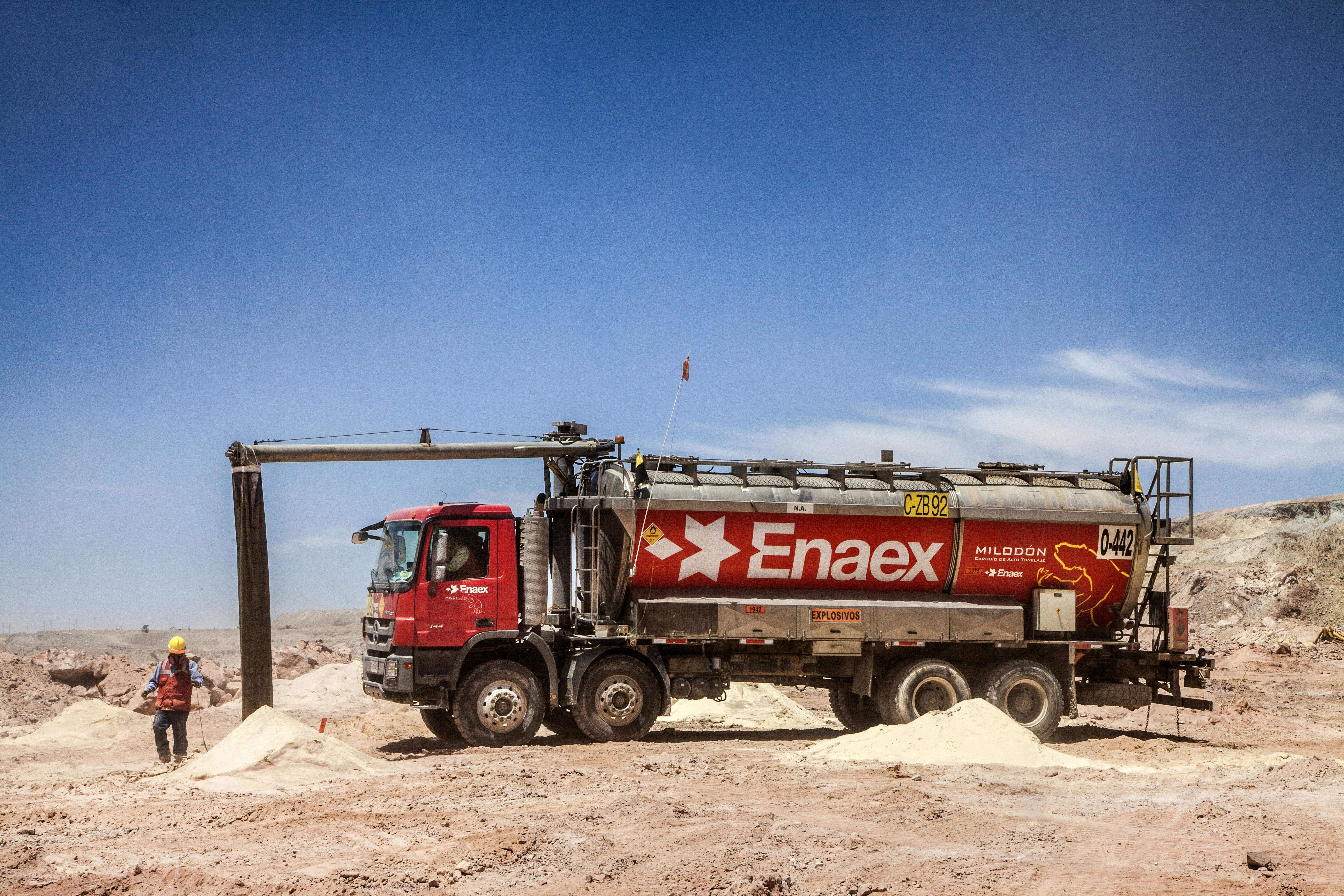 Large water tanker truck on dusty construction road site in South Africa industrial environment