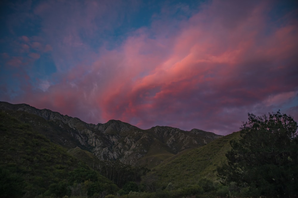 grass mountains during day