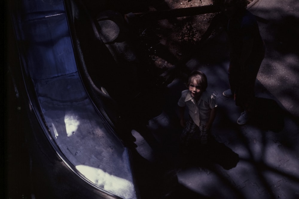 a man standing in front of an escalator