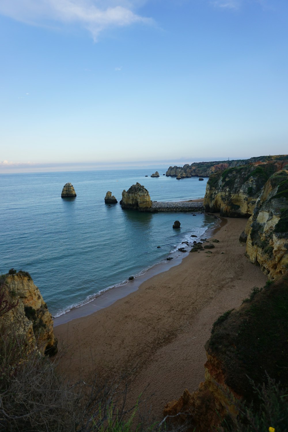 brown rock formation on sea shore during daytime