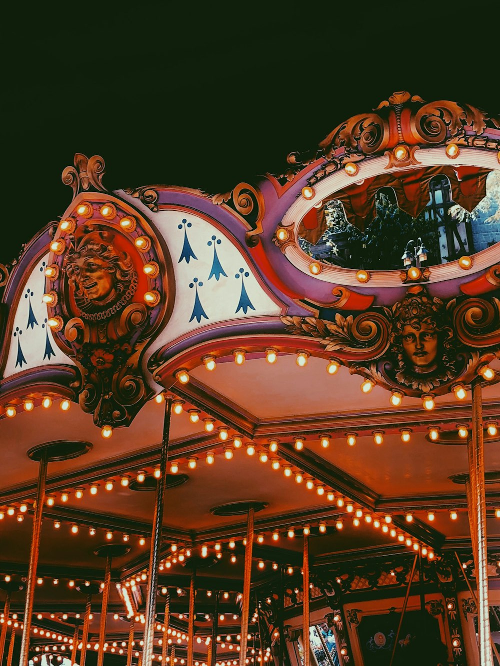 multicolored carousel amusement park ride