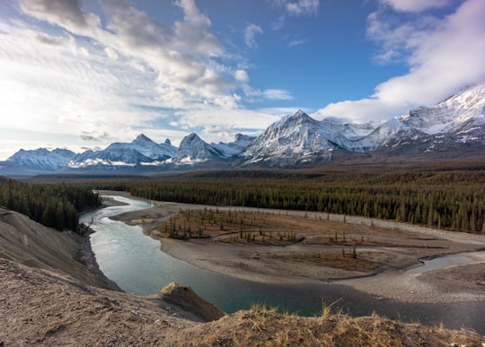 snow covered mountain under cloudy sky in Athabasca River Canada