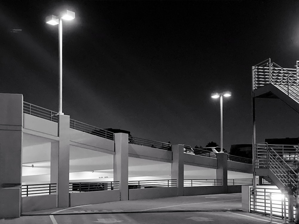 grayscale photography of stairs and lights