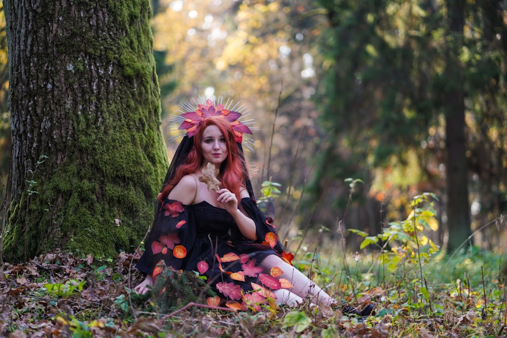 woman sitting near tree