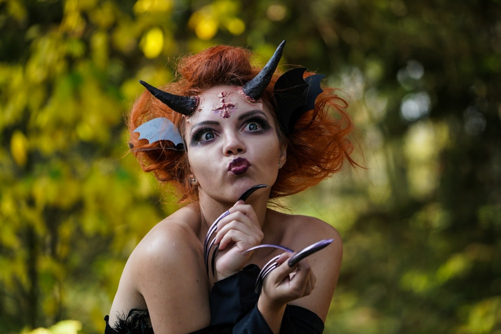 woman in Halloween costume standing in forest