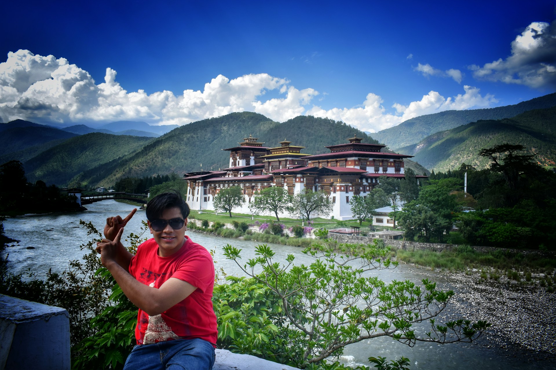 woman wearing yellow long-sleeved dress under white clouds and blue sky during daytime