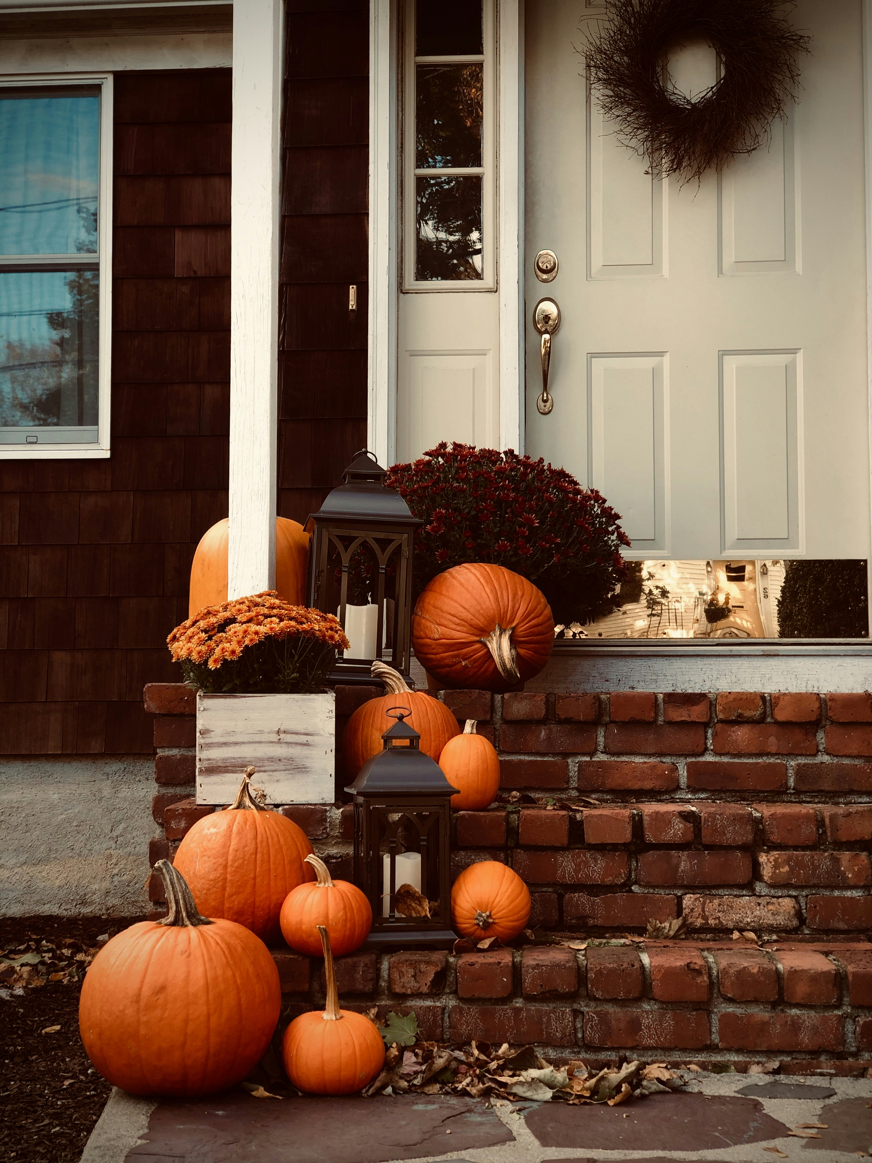 Our front porch, decorated with lanterns, pumpkins and colorful mums for the fall season. Rhode Island, USA -- homes and decor like this are very common in New England/Northeastern United States