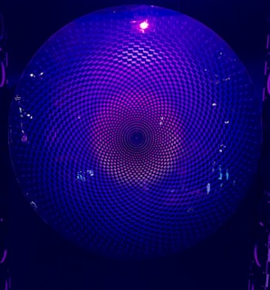Abstract blue and purple quantum circuit pattern glowing with subtle motion hints.
