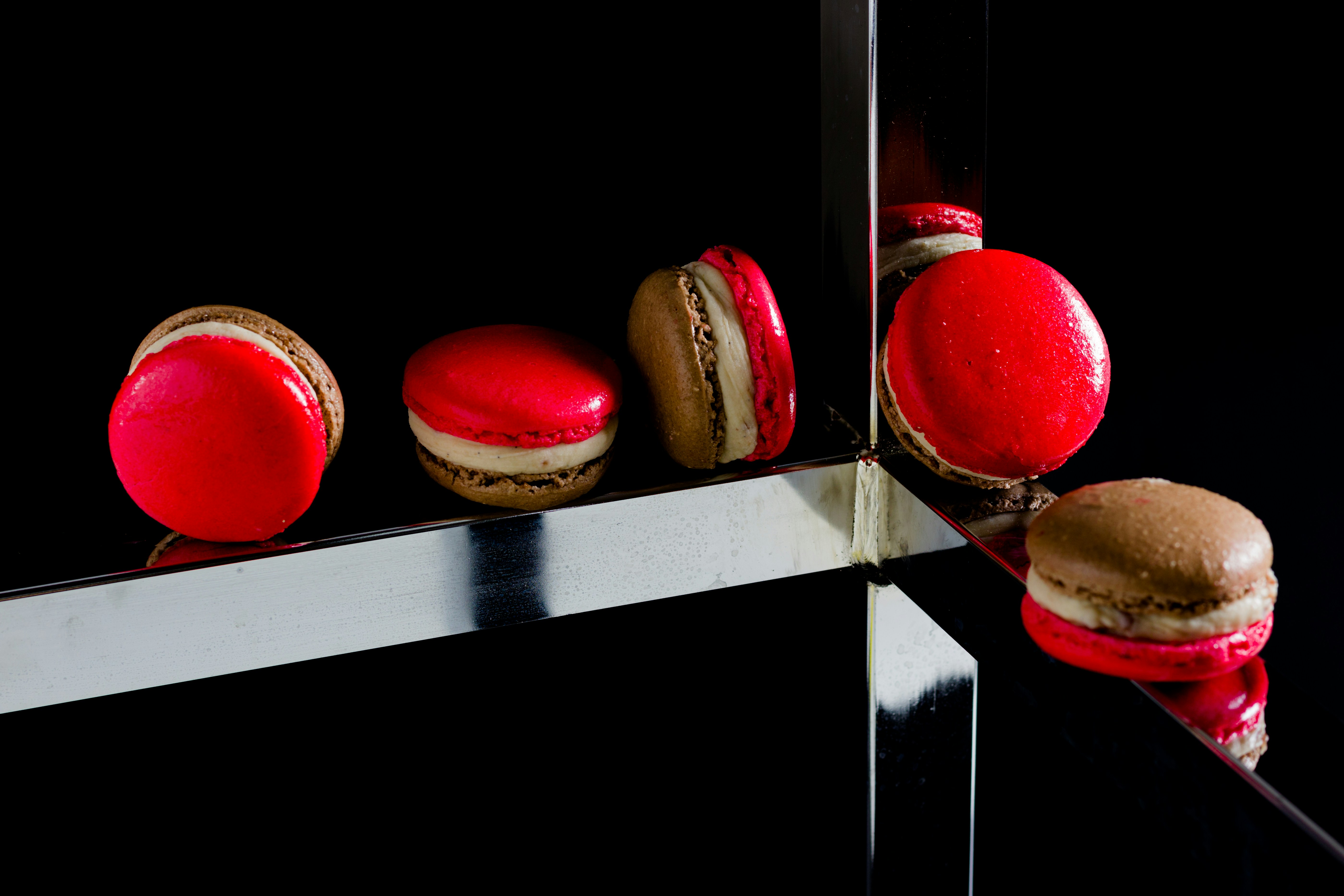 Red macarons with mirror reflection