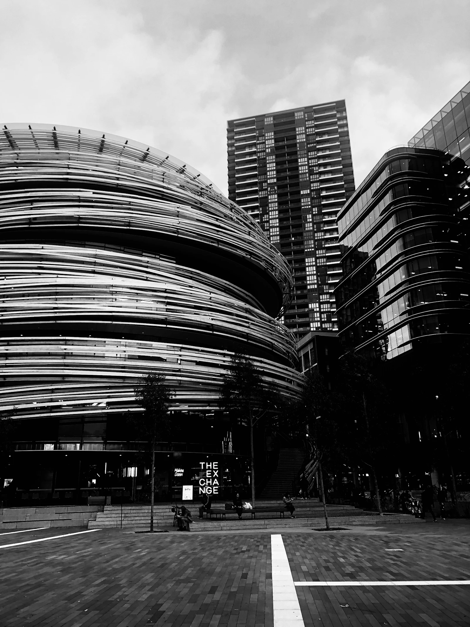 Black and white view down a Sydney laneway between tall buildings
