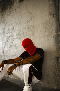man wearing black shirt and red mask
