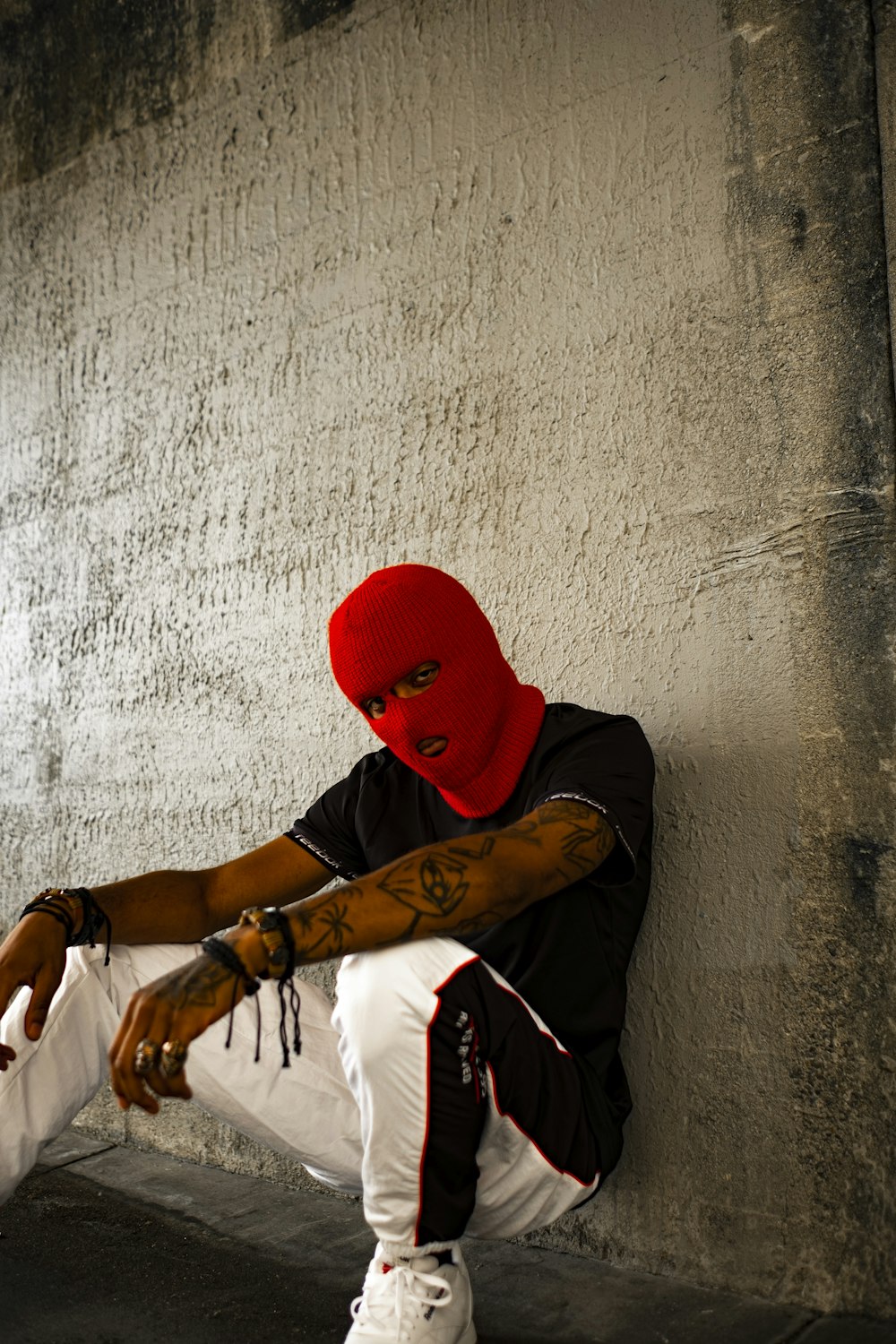 man wearing black shirt and red mask