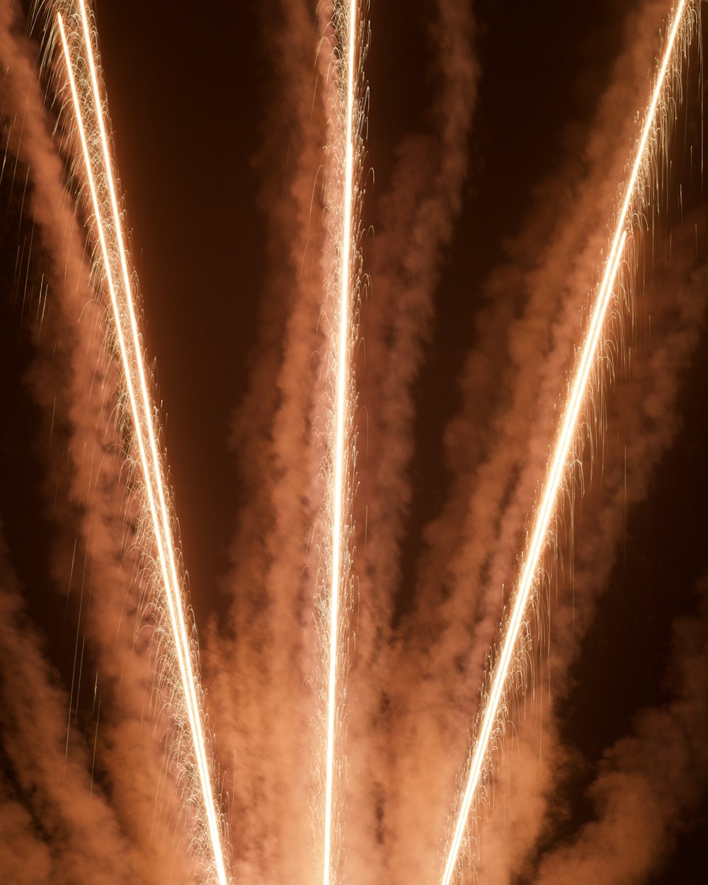 a bunch of fireworks are lit up in the night sky