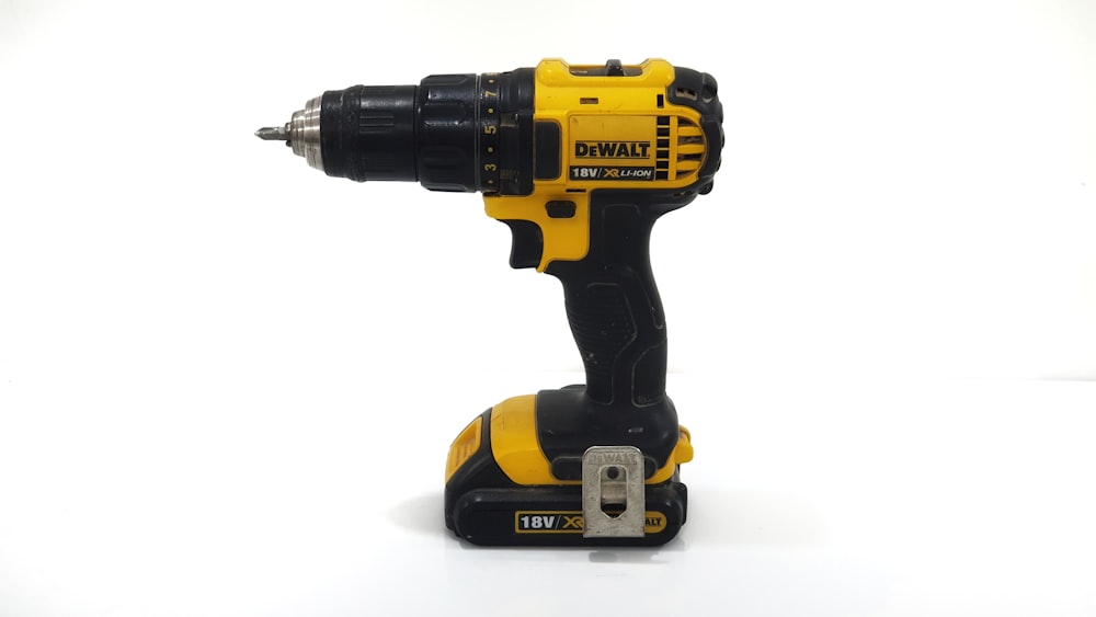 black and yellow DEWALT cordless drill