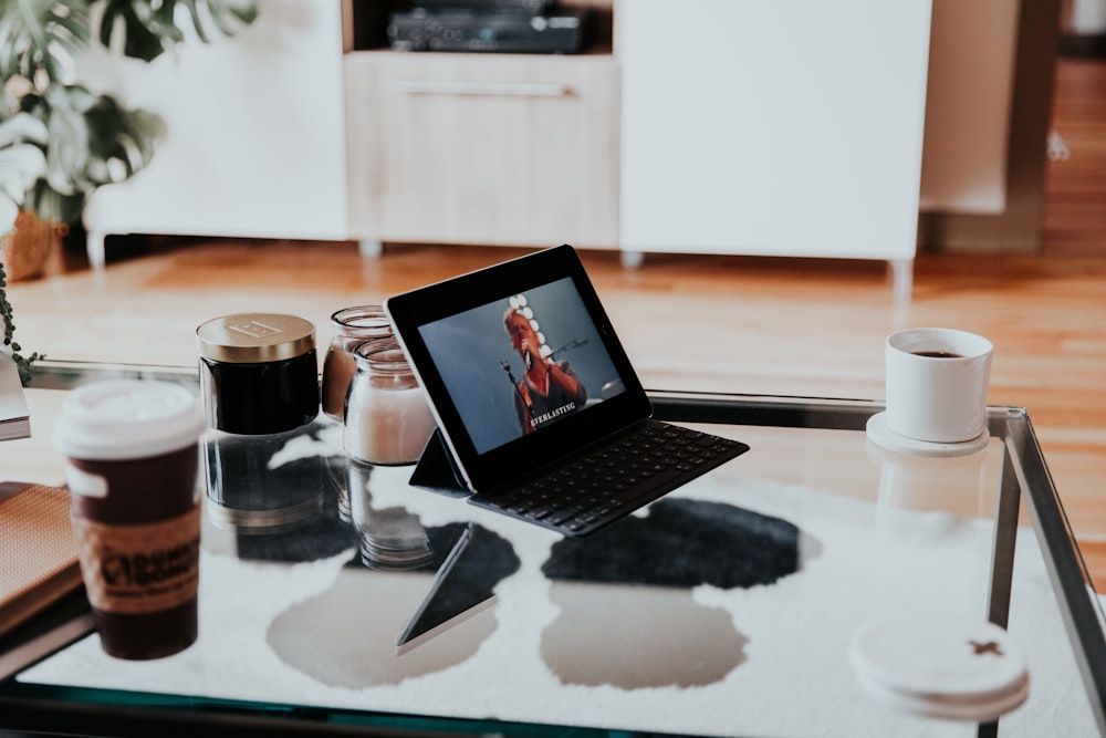 black tablet computer on top of table