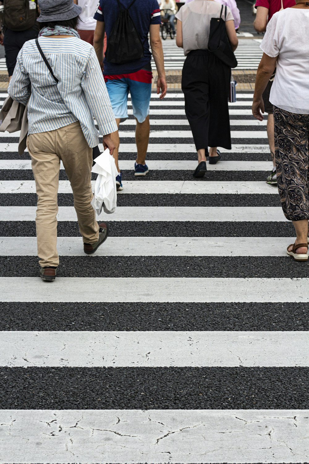 women walking on pedestrian lane