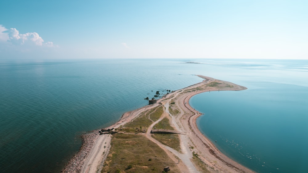 an aerial view of a long stretch of road next to the ocean