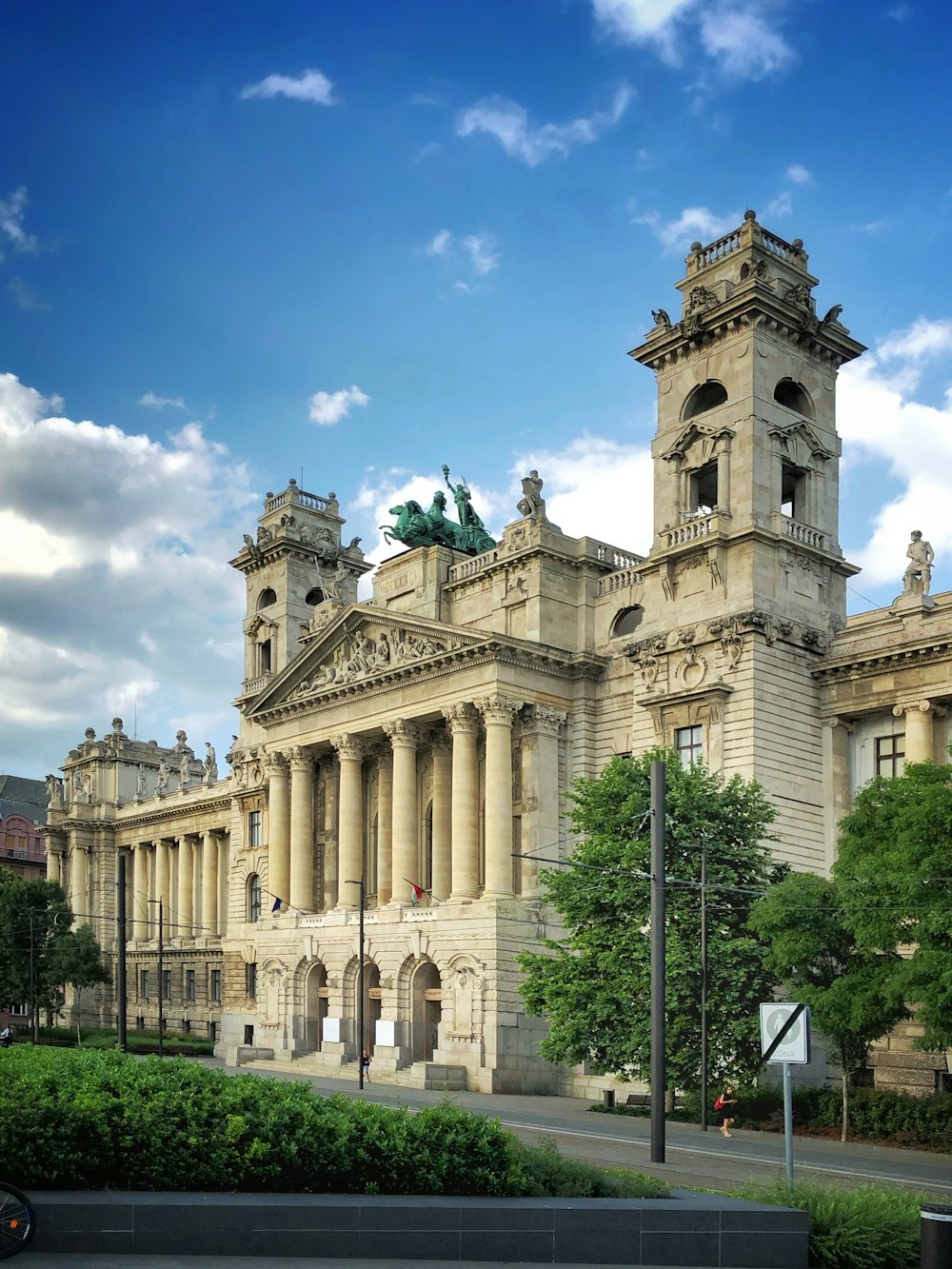 palace near street under cloudy sky