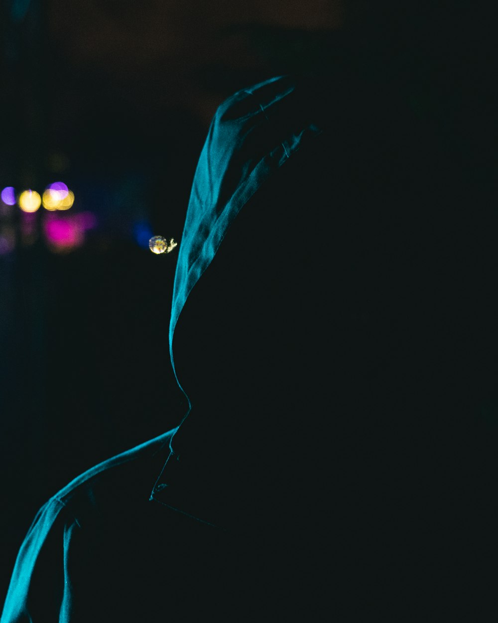 person wearing blue hooded jacket