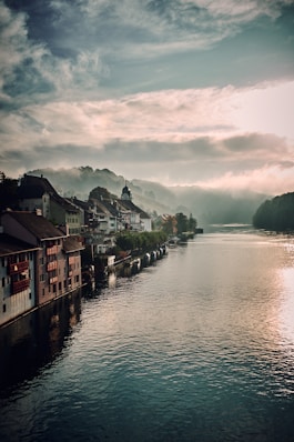 assorted-colored houses and lake