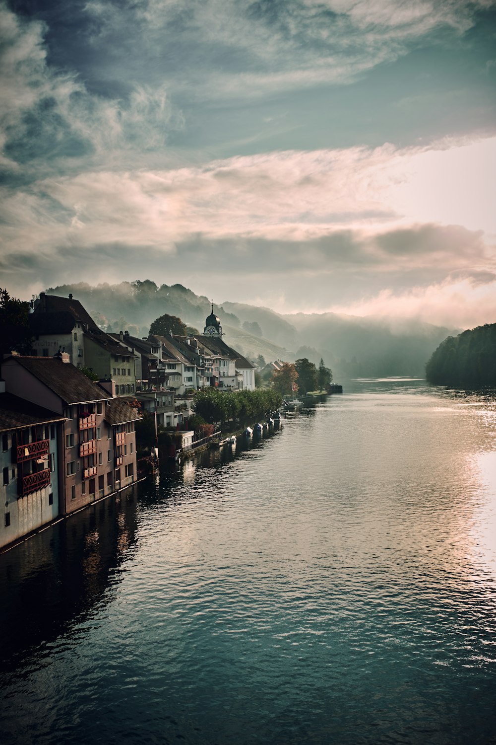 assorted-colored houses and lake