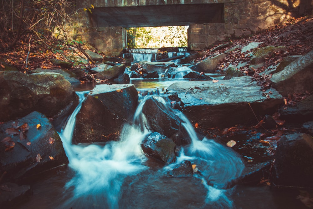 water stream under bridge