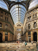 people walking inside brown building structure
