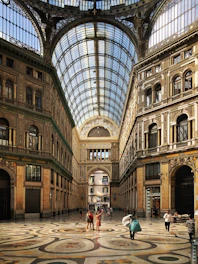 people walking inside brown building structure