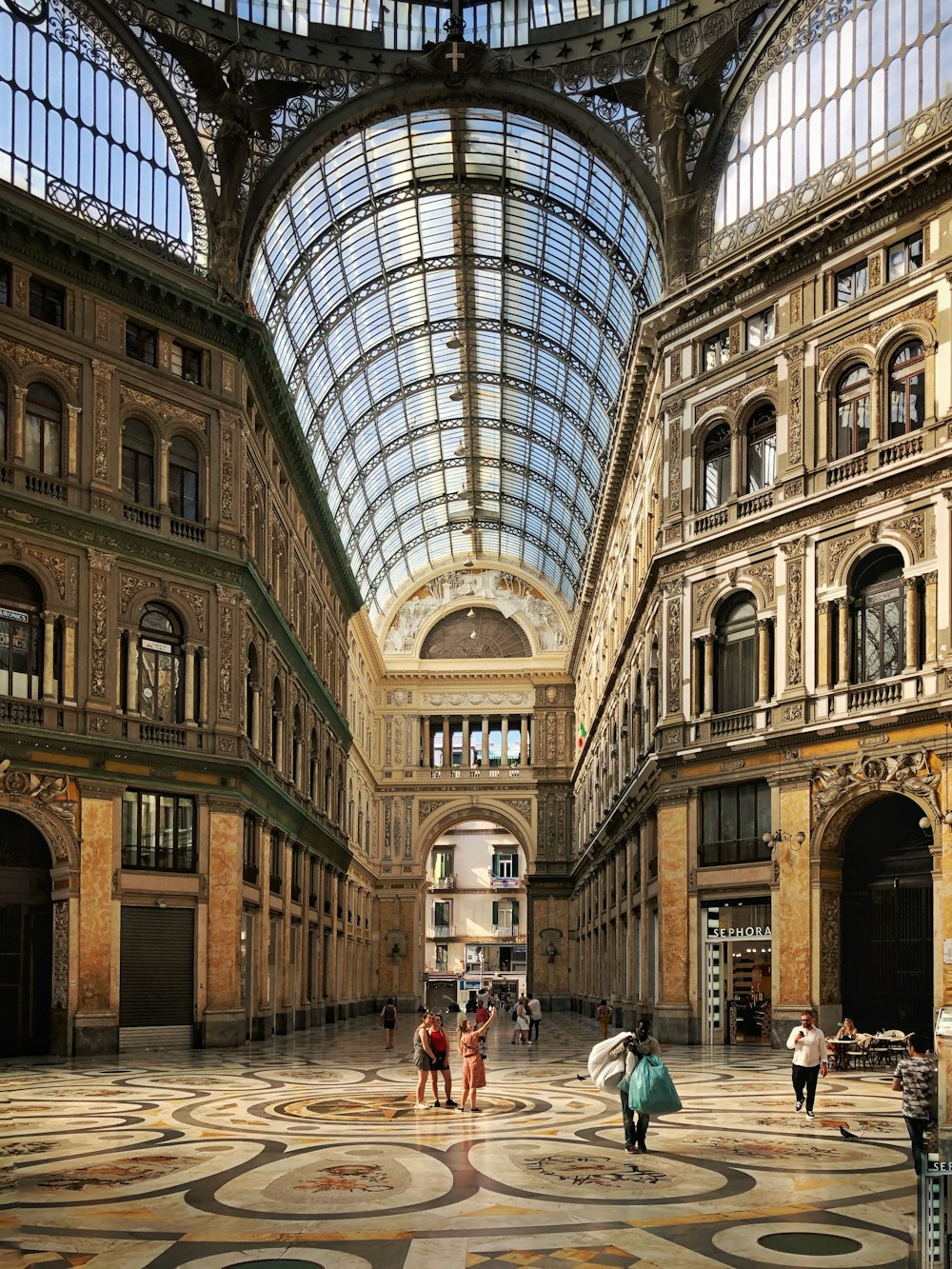 people walking inside brown building structure