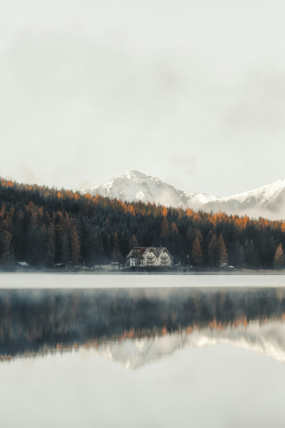 white and brown house near at lake