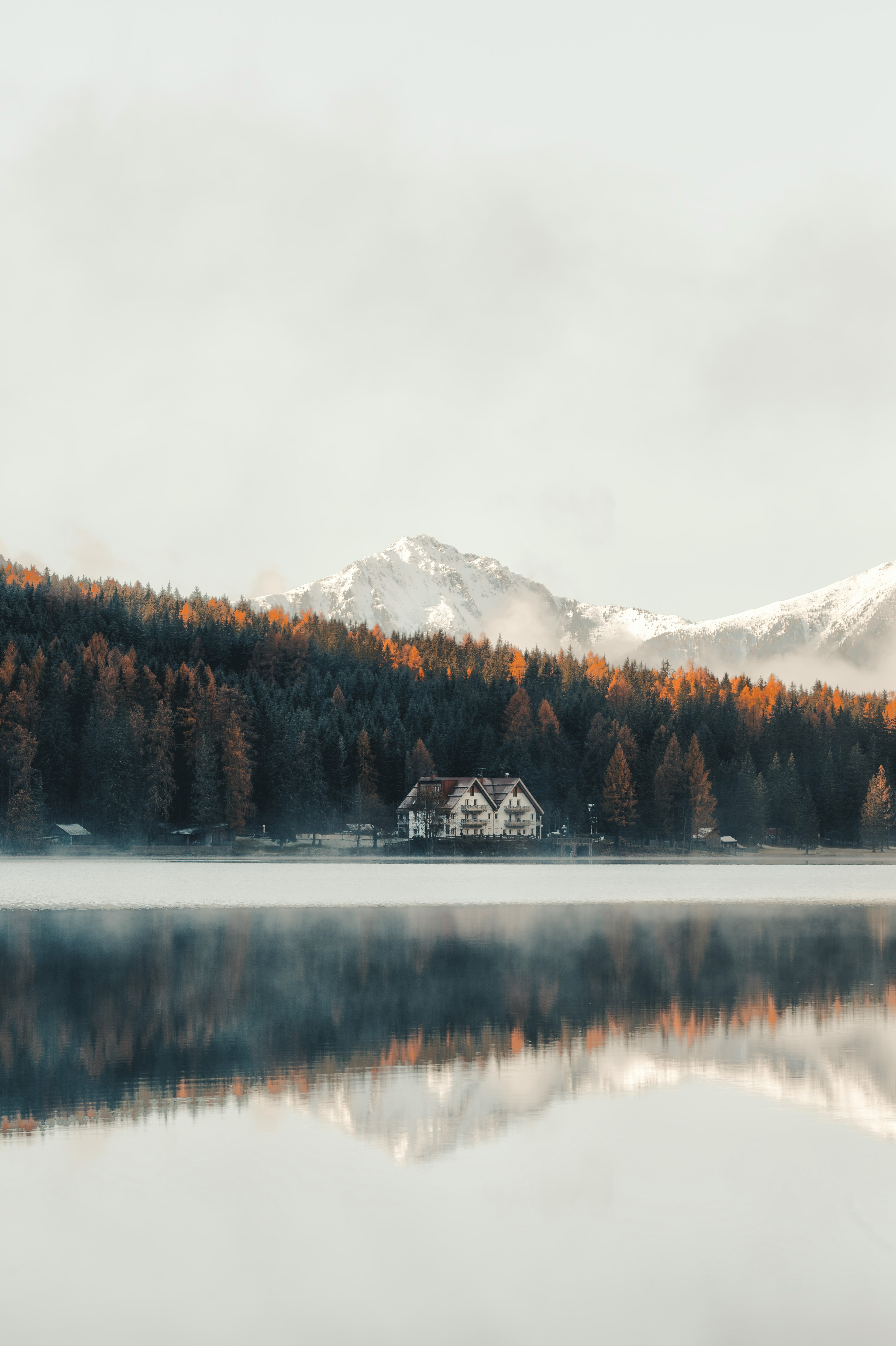 white and brown house near at lake