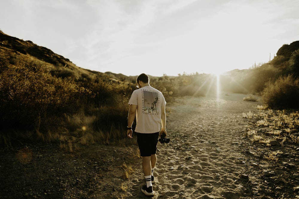 man in white shirt on hill