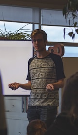 man standing near board